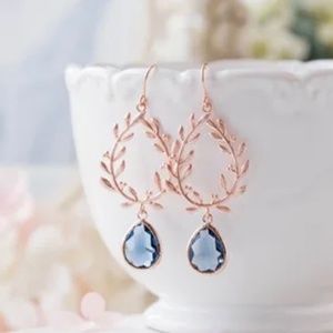 Rose gold earrings with blue stone. Brand new. Never worn.